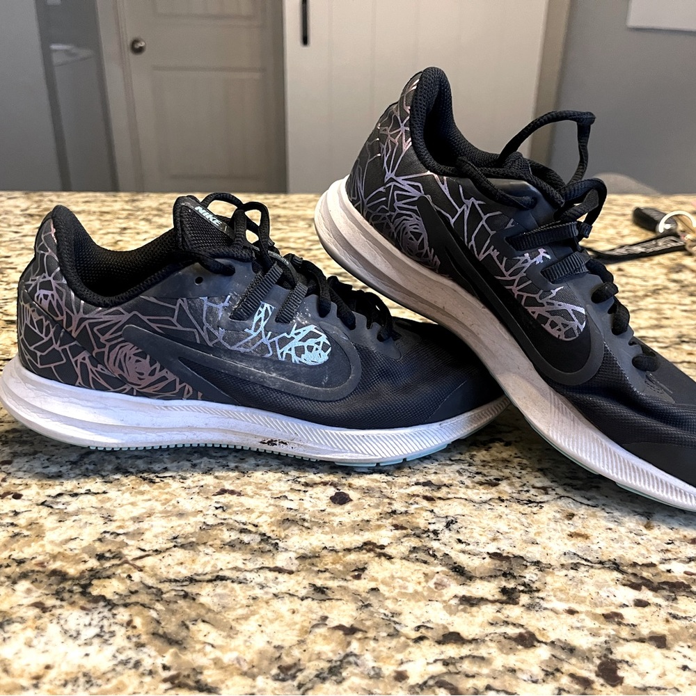 Nike downshifter shoes. 5Y black. Used. Normal wear.